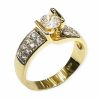 Μονόπετρο χρυσό δαχτυλίδι με πλαινές πέτρες