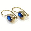 Χρυσά κρεμαστά σκουλαρίκια με μπλε πέτρες