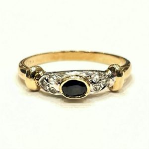Χρυσό δαχτυλίδι με σκούρα μπλε πέτρα